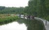 Narrow boats on the canal by the wheel 