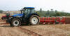 New Holland tractor with a 5 furrow turnover plough 